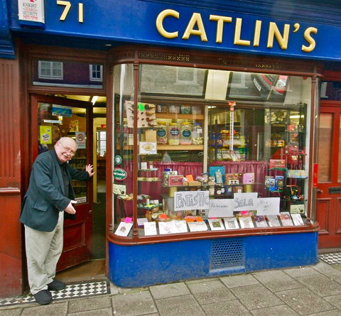 Catlin welcoming customers into his shop